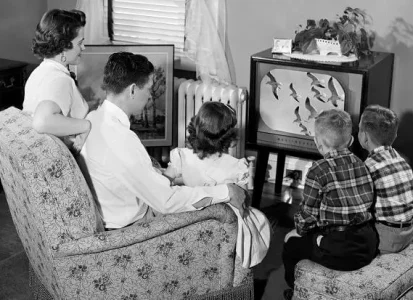 Family sitting around the TV